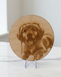 Laser-engraved wooden coaster with dog portrait on display stand