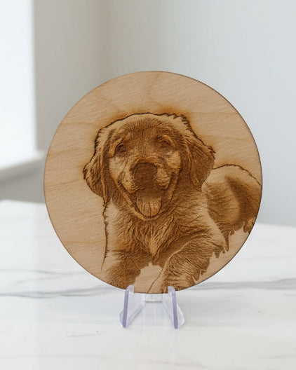 Laser-engraved wooden coaster with dog portrait on display stand