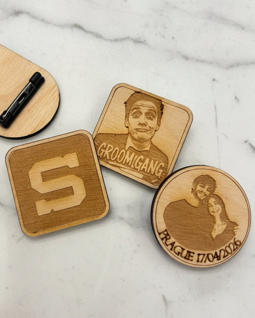 Custom laser-engraved wooden pins in round, square and diamond shapes